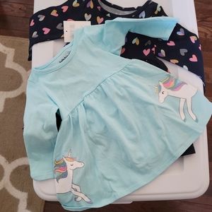 Two 12 month Jumpin Beans long-sleeved dresses
